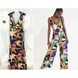 Urban Outfitters Bold Patchwork Jumpsuit Crossover Deep V Size 4 Orange Black
